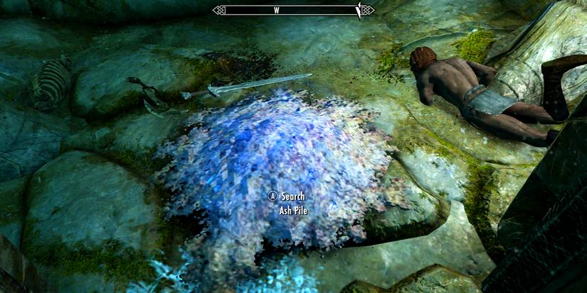 ash pile next to a corpse.