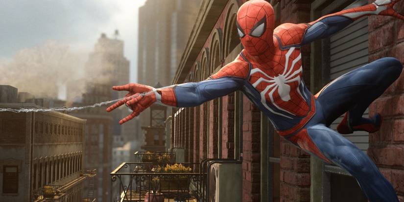 spiderman hanging on wall shooting out web fluid