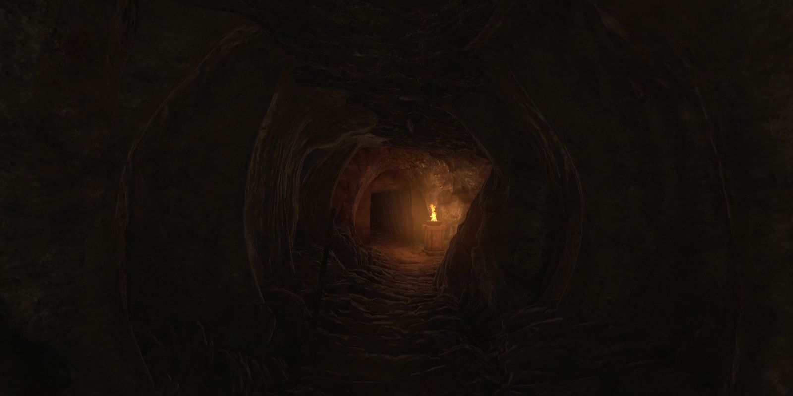 A dark cave with a light at the end.