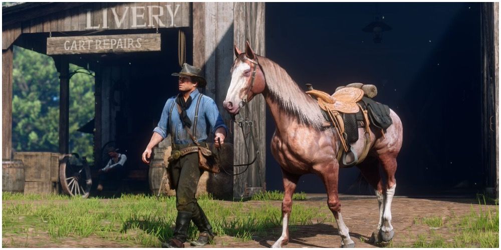 Arthur leading a horse out of a stable