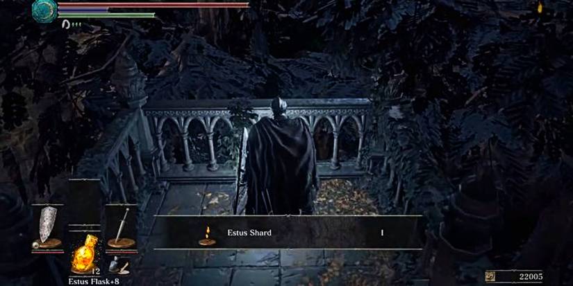 corpse that can be looted for the estus shard on a railing.