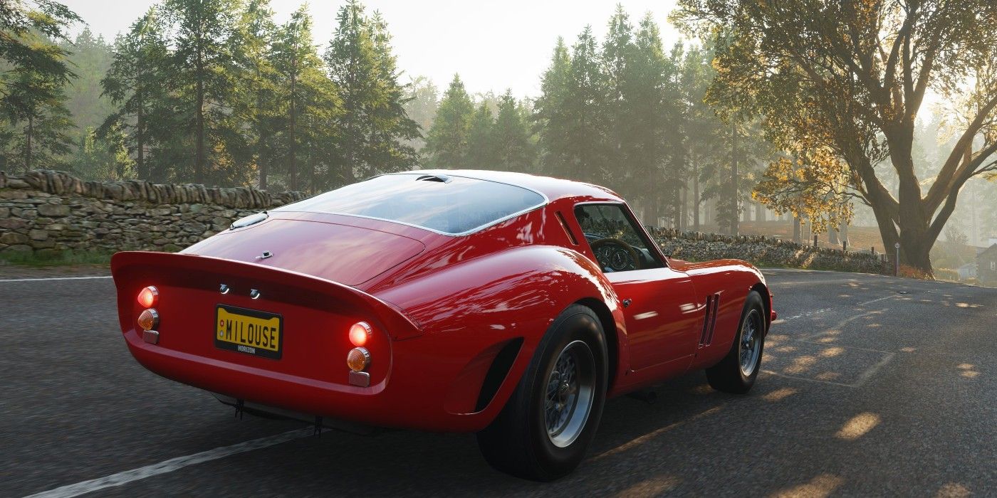 Forza Horizon 4 Ferrari 250 GTO three quarters view driving ahead on road with trees in distance