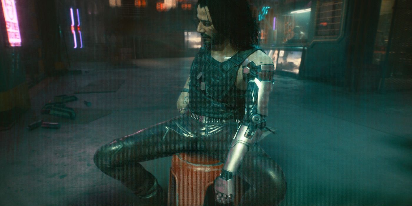 Johnny Silverhand sits on a bucket in Cyberpunk 2077