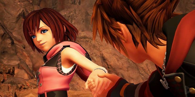 Kairi holds Sora's hand in Kingdom Hearts 3