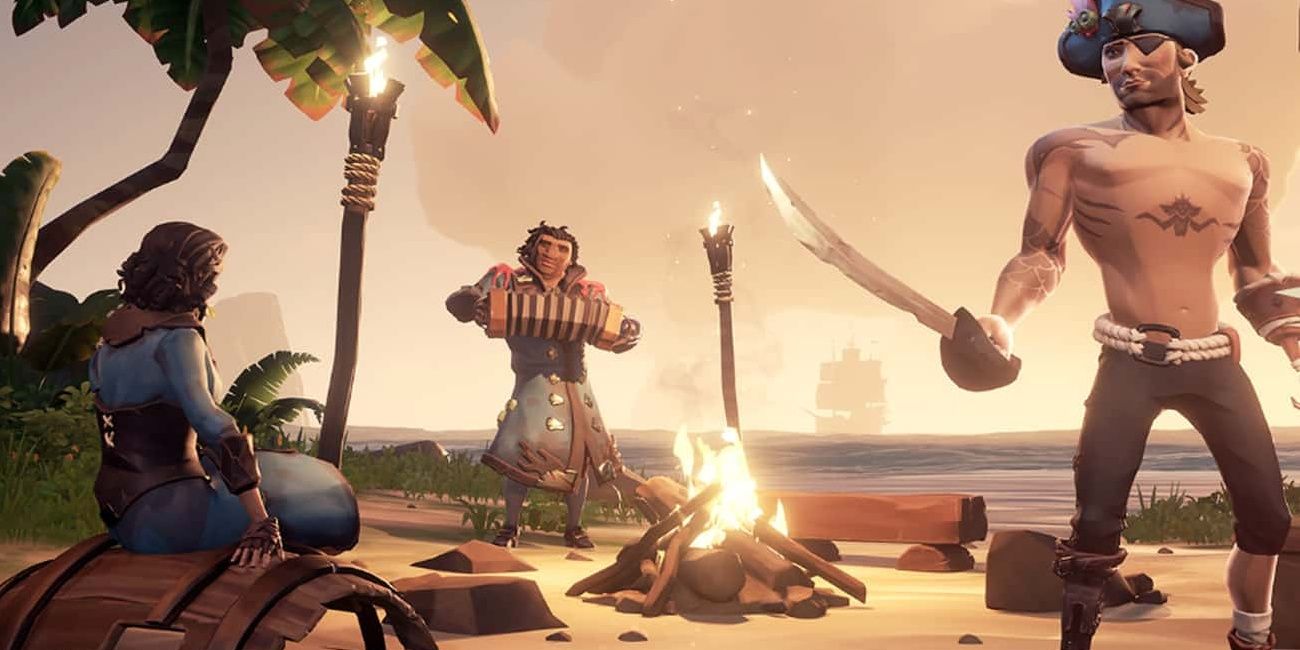 A pirate lights a campfire in Sea of Thieves