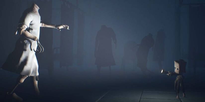 A headless manaquin freezes in Monos beam of light