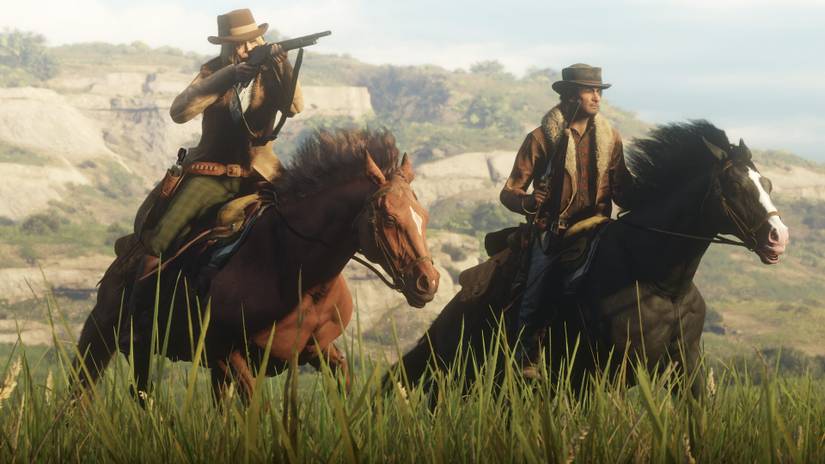 Red Dead Online players on horseback wielding a shotgun