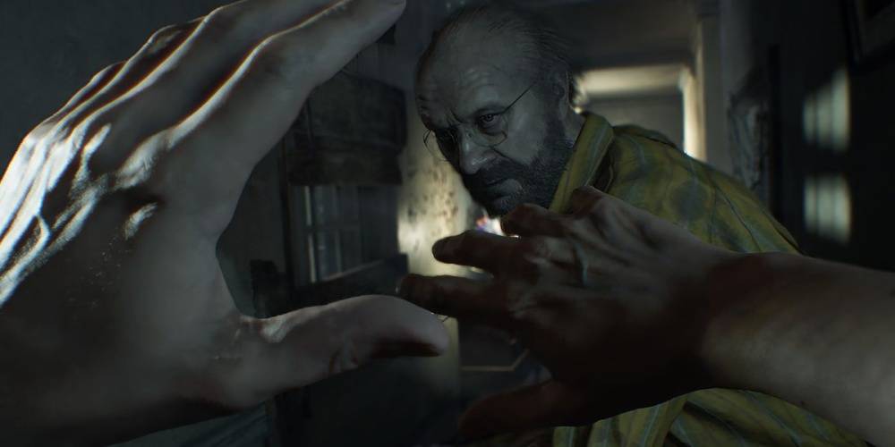 In Resident Evil 7, a first-person camera sees the Ethan (the protagonist) shield his face with his arms from a close and leaning Jack Baker, who is wearing a yellow dress shirt