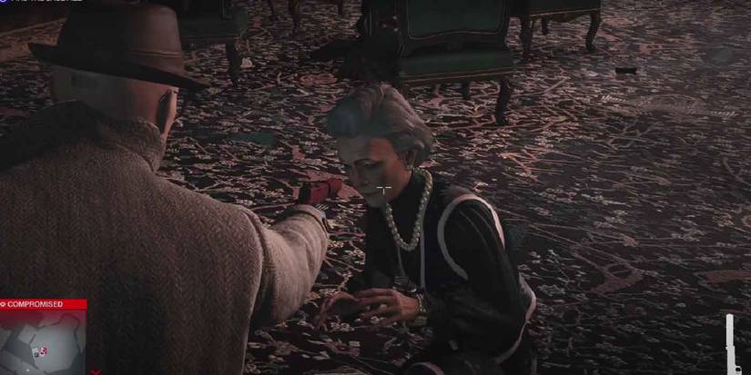 Hitman 3. Holding a gun on someone for secret dialogue.