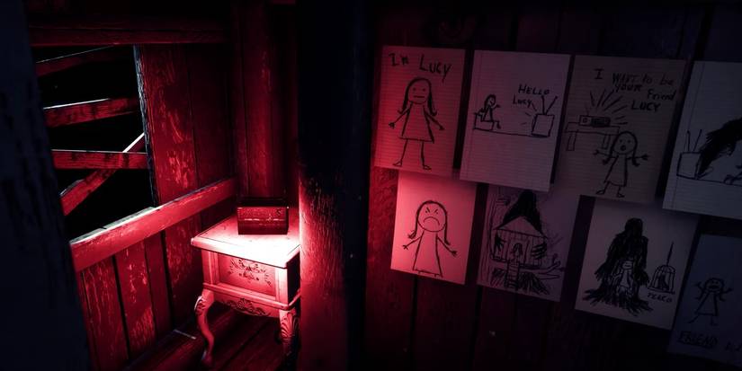 A red lit treehouse interior with disturbing drawings