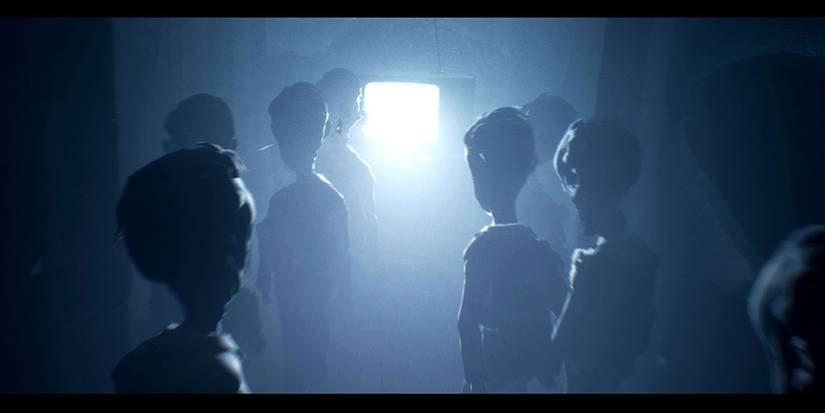 The Viewers gather around to stare into the TV