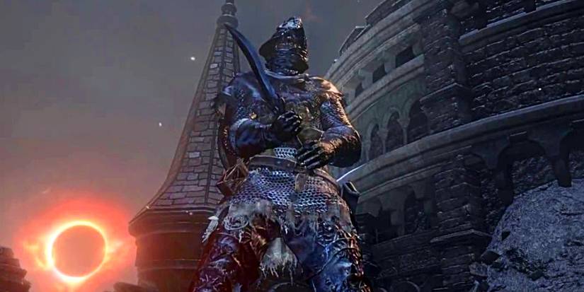 player holding a curved dagger in two hands.