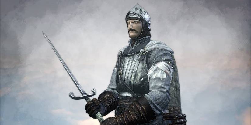 close up of player holding a large dagger in two hands on a white and grey background.