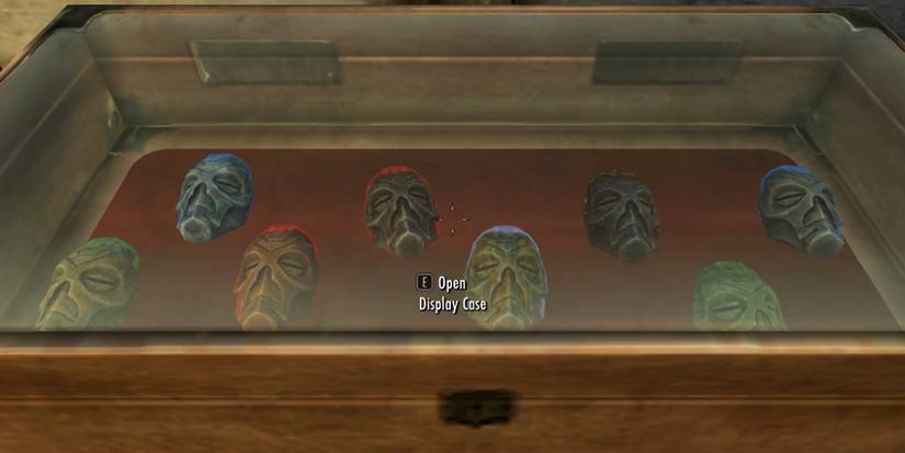 Dragon priest masks in a display case