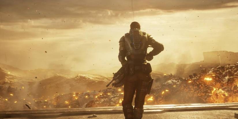 a cog soilder looking onward at ruined landscape