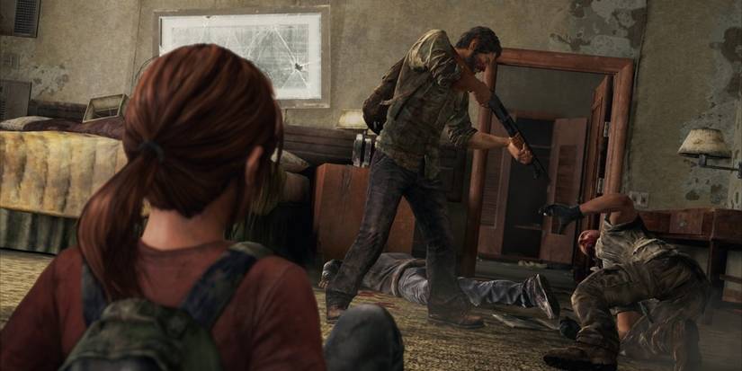 Joel Points A Gun At An Enemy