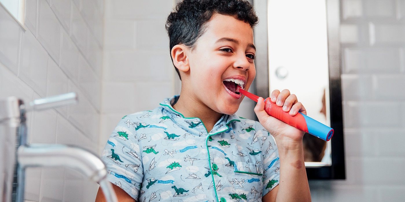 A child brushing their teeth