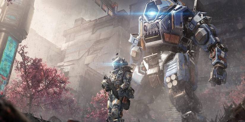 a pilot with a titan standing behind him