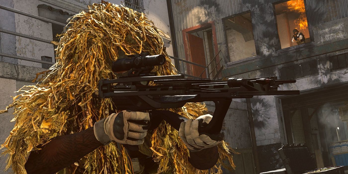 warzone player in ghillie suit aiming weapon