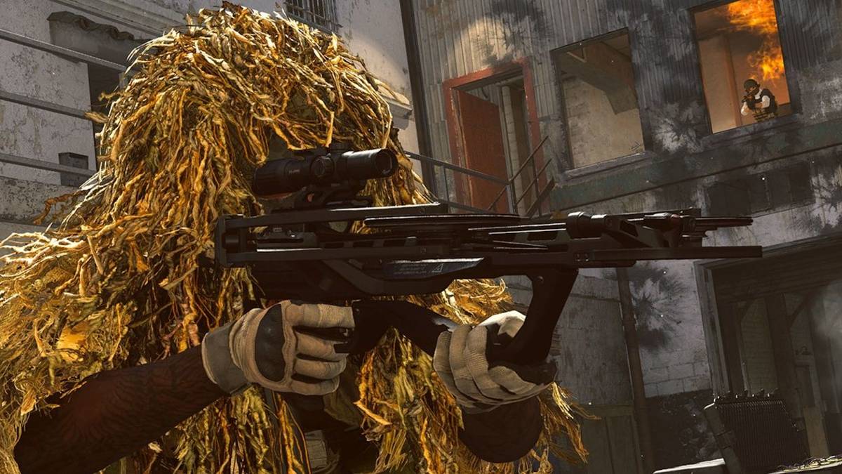 warzone player in ghillie suit aiming weapon