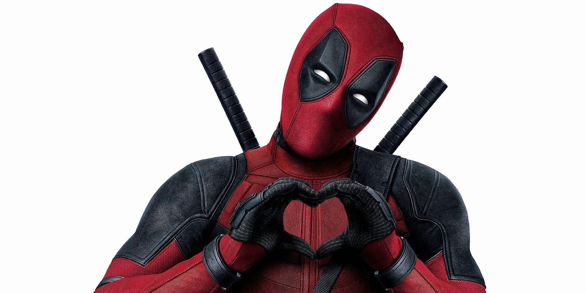 Deadpool making a heart shape with his hands