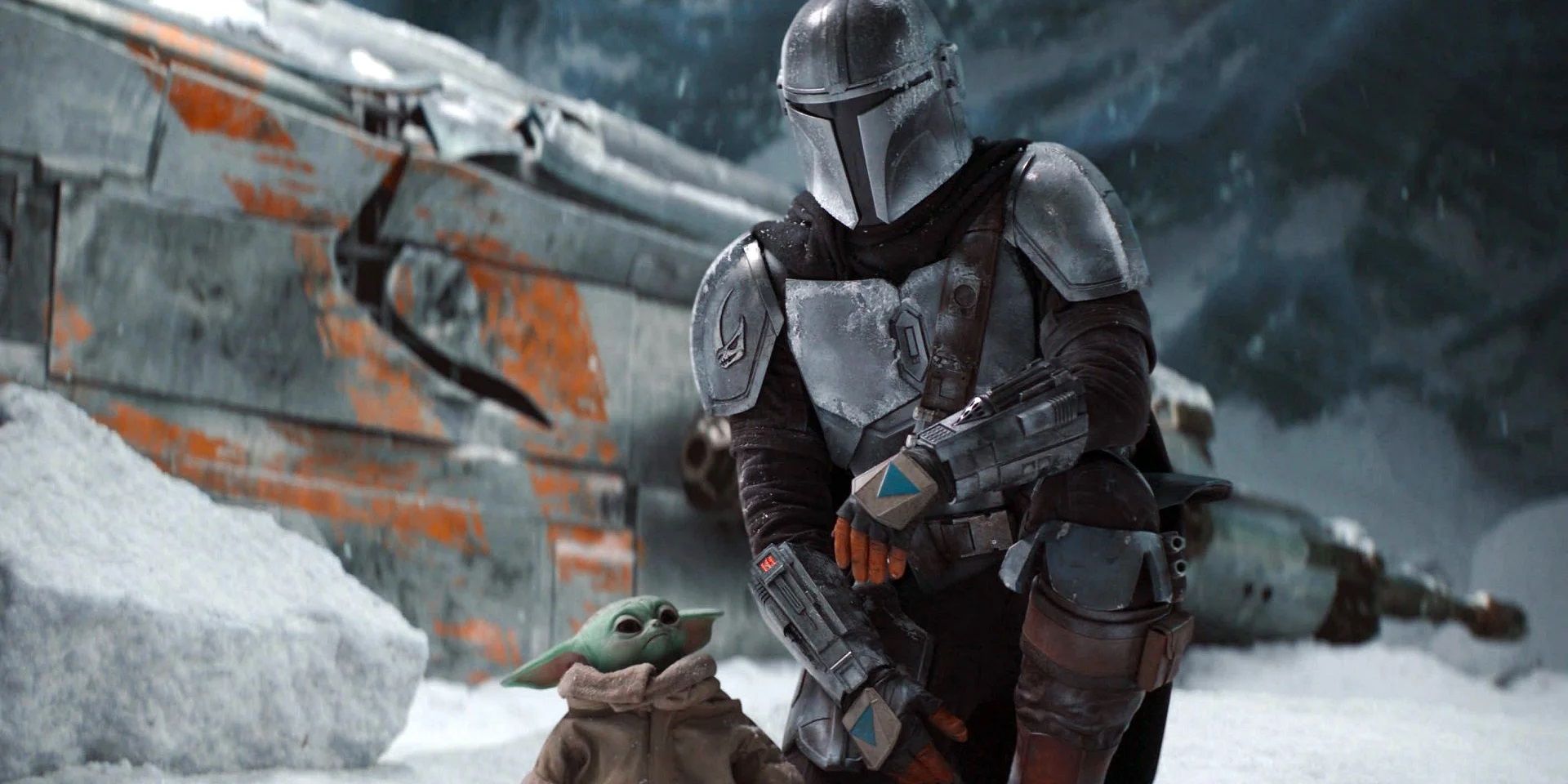 Din Djarin and Grogu next to the crashed Razor Crest in The Mandalorian (star wars)