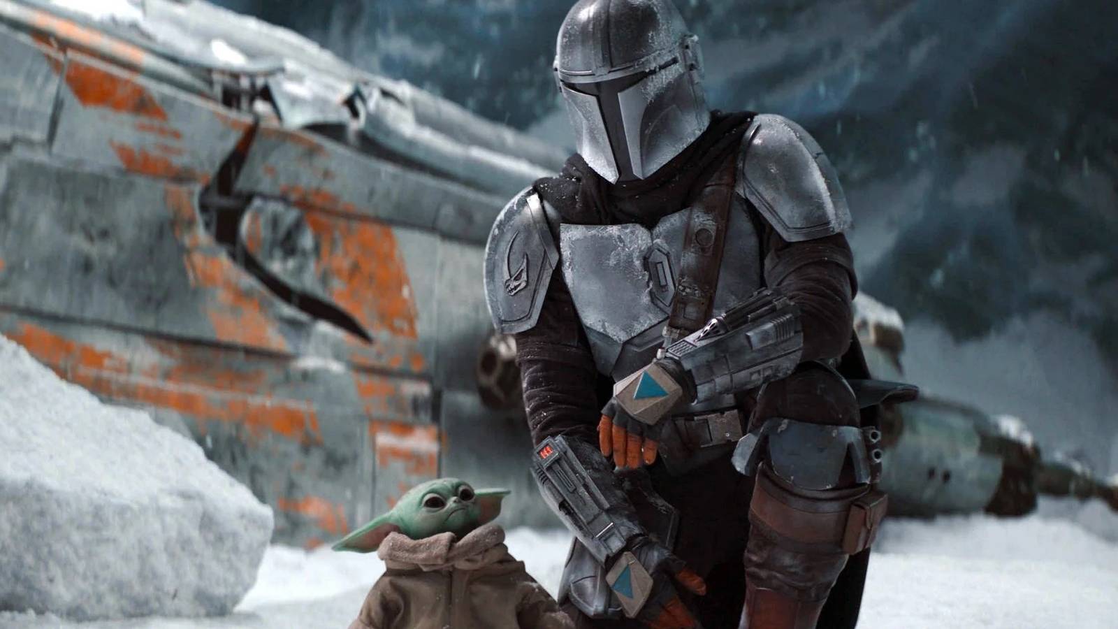 Din Djarin and Grogu next to the crashed Razor Crest in The Mandalorian (star wars)