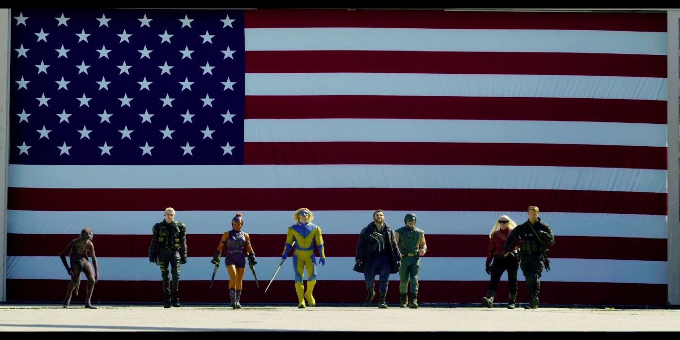 Entire Suicide Squad Walking With American Flag Behind Them