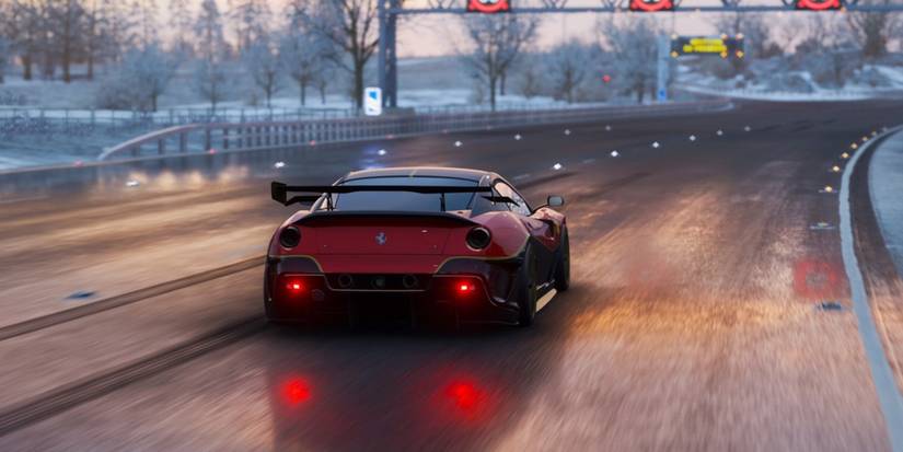 Forza Horizon 4 Ferrari 599XX Evolution driving down winter slick road