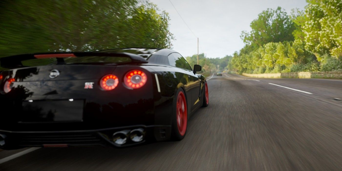 Forza Horizon 4 Nissan GT-R Black Edition zipping through street back view