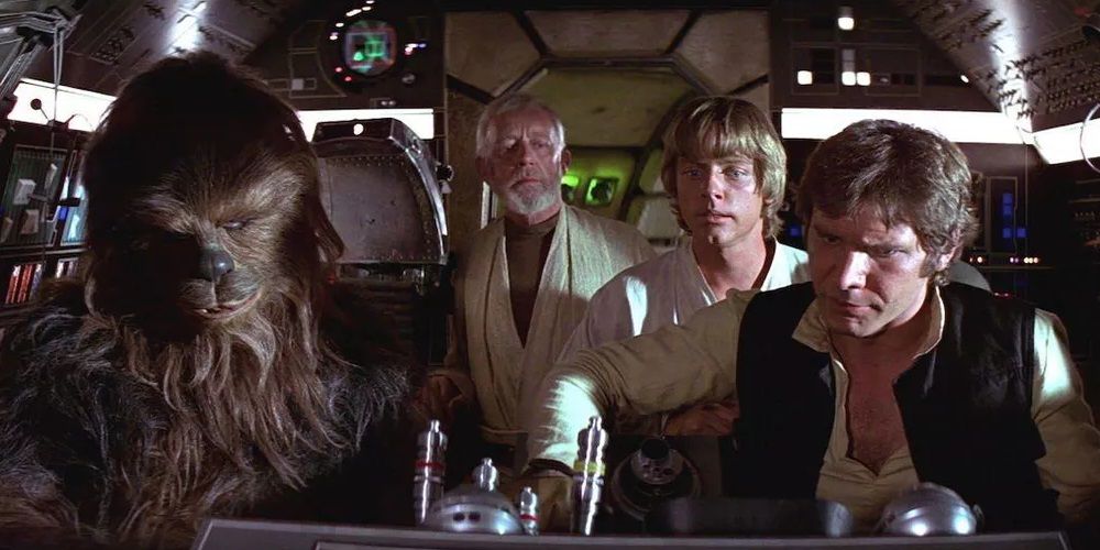 Han, Chewbacca, Obi-Wan, and Luke in the cockpit of the Millennium Falcon