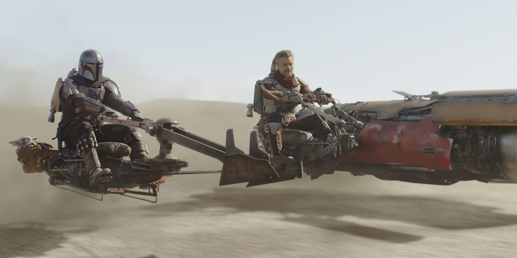Mando and Cobb Vanth ride through the desert in The Mandalorian