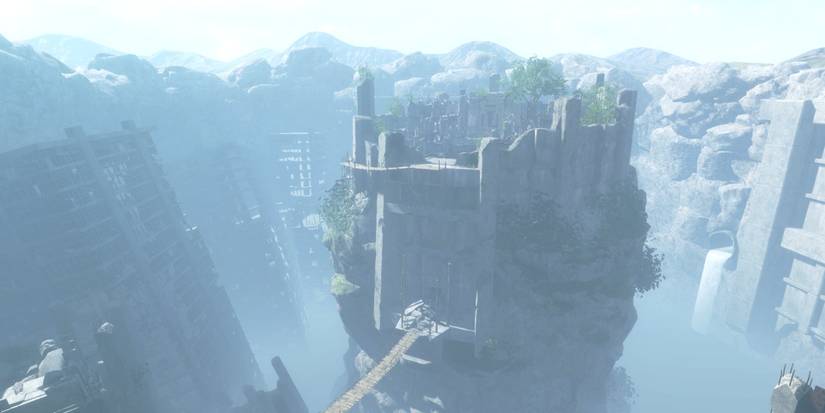 Nier Replicant environment gigantic rock temple inside cavern with wooden bridge across it