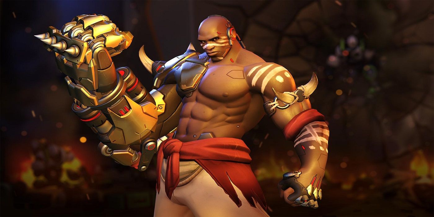 Doomfist posing with giant gold glove in Overwatch