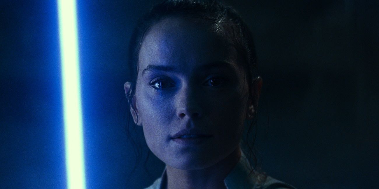 Rey holding a lightsaber in The Rise of Skywalker