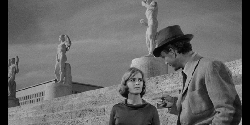 The Girl Who Knew Too Much still, black and white image of girl talking to detective with lark marble statues in the background