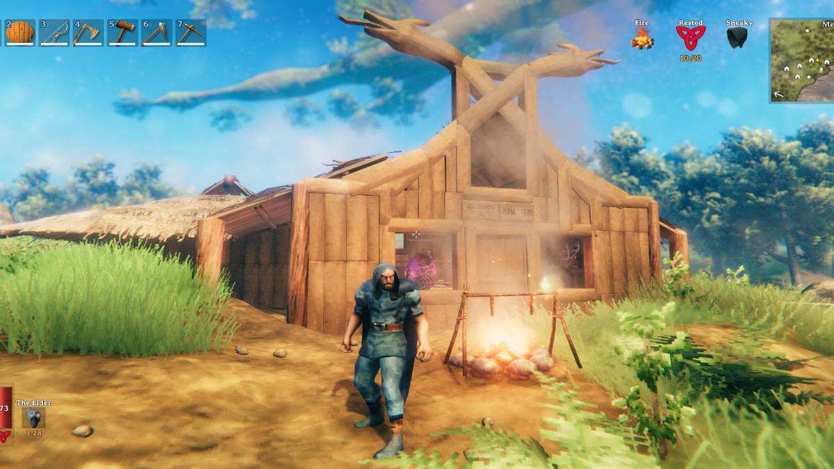 A warrior in a blue cloak stands outside a building with items in the window