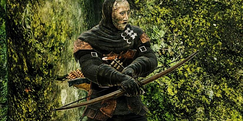 close up of a player holding a simple wooden bow.