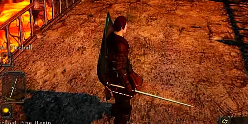 player holding a fire and physical thrusting sword.