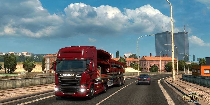 Screenshot from Euro Truck Simulator 2 showing a red Scania truck/