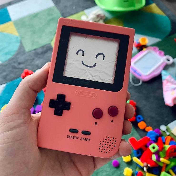 Photo of a salmon pink replica Game Boy created by a Reddit user