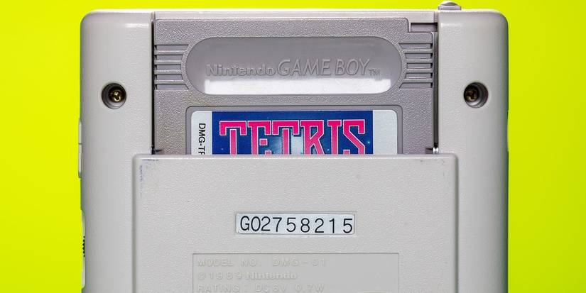 Photo of the back of a Nintendo Game Boy showing a Tetris cartidge in the slot.