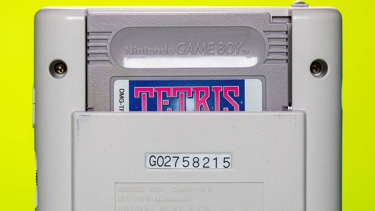 Photo of the back of a Nintendo Game Boy showing a Tetris cartidge in the slot.