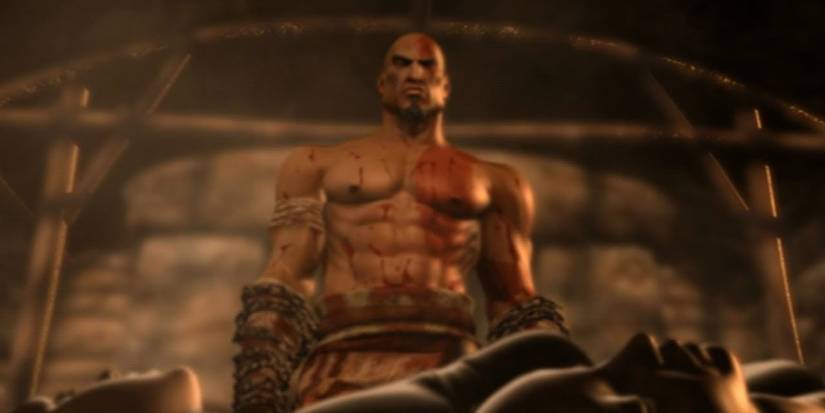Kratos looks down on his dead wife and daughter in the first God of War game