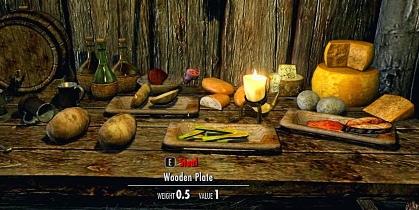 cheese and other nice food on a wooden table indoors.