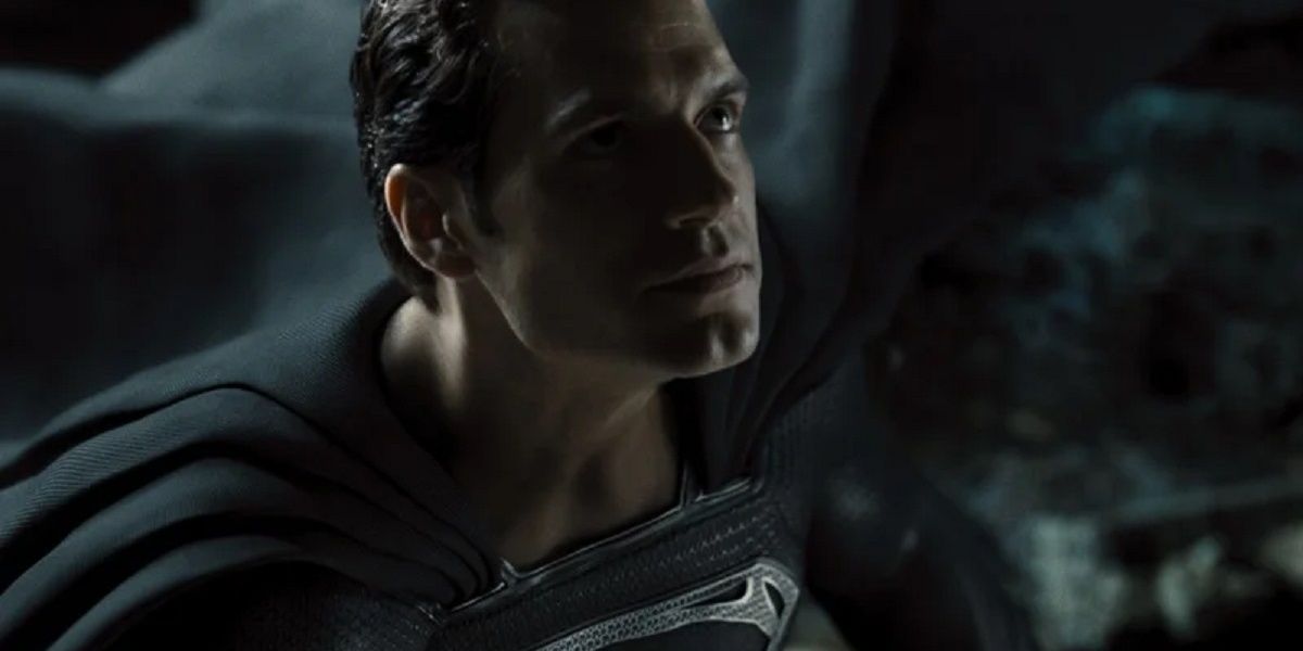 superman looks up while wearing black suit Cropped