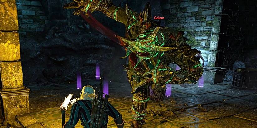 geralt fighting a golem.