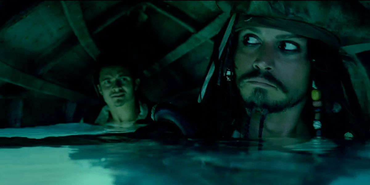 jack and will holding a boat upside down underwater