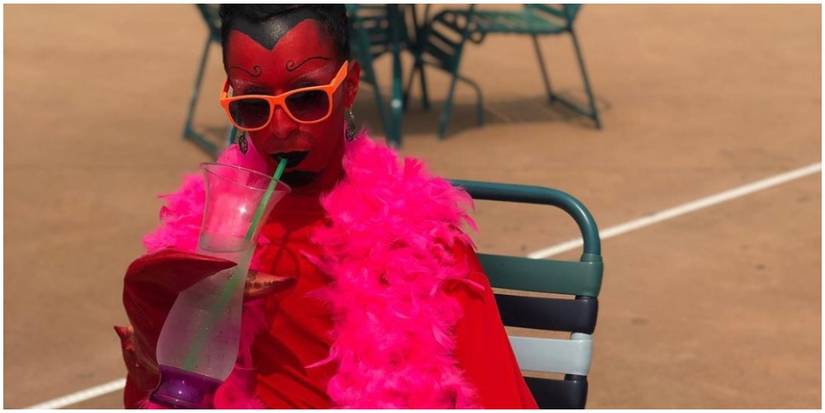 A cosplay of HIM drinking something