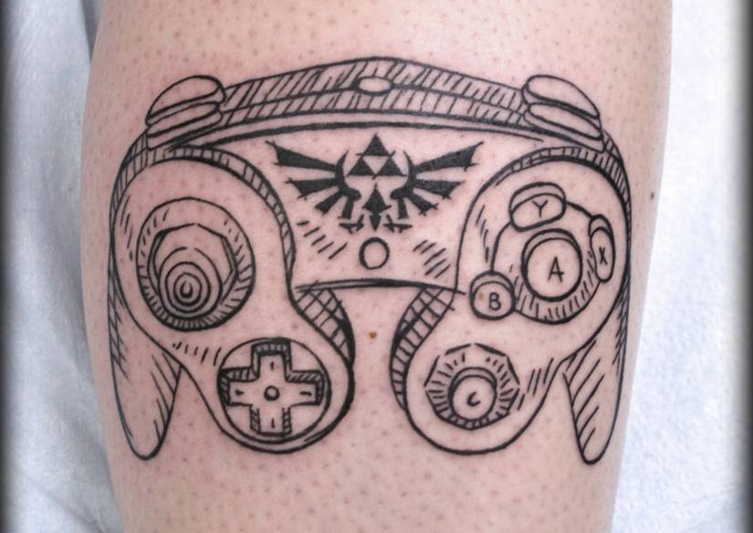 Gamecube controller with Zelda symbol.